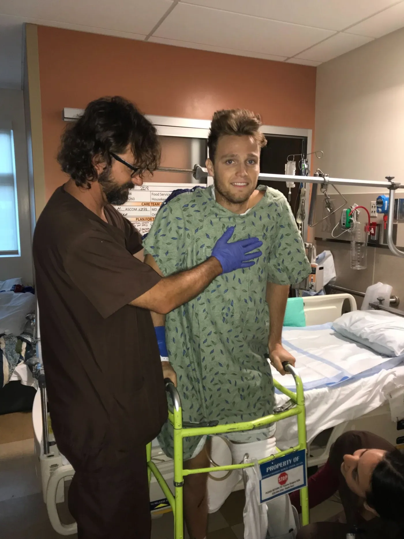 Ian taking his first steps with a walker